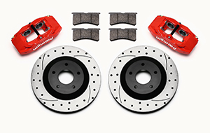 Wilwood SLC56 Front Replacement Caliper and Rotor Kit Parts Laid Out - Red Powder Coat Caliper - SRP Dimpled & Slotted Rotor